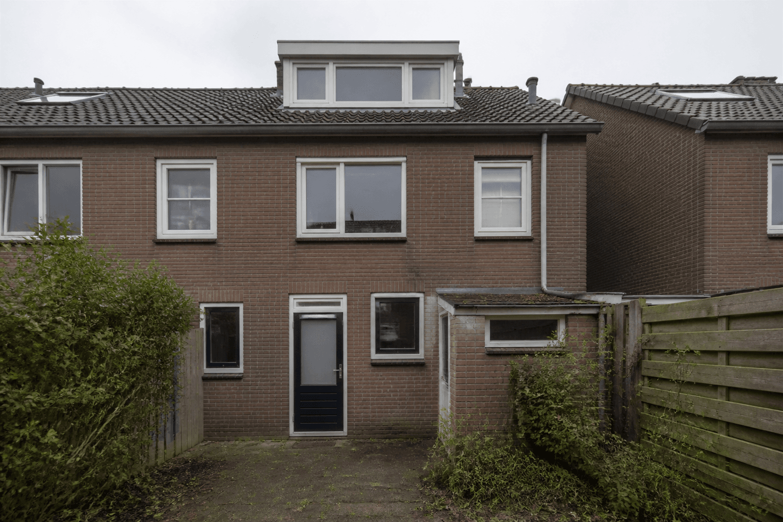 Achtergevel vóór de aanbouw